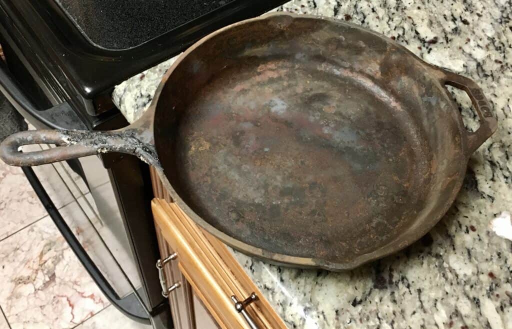Cast iron skillet pulled from the ashes
